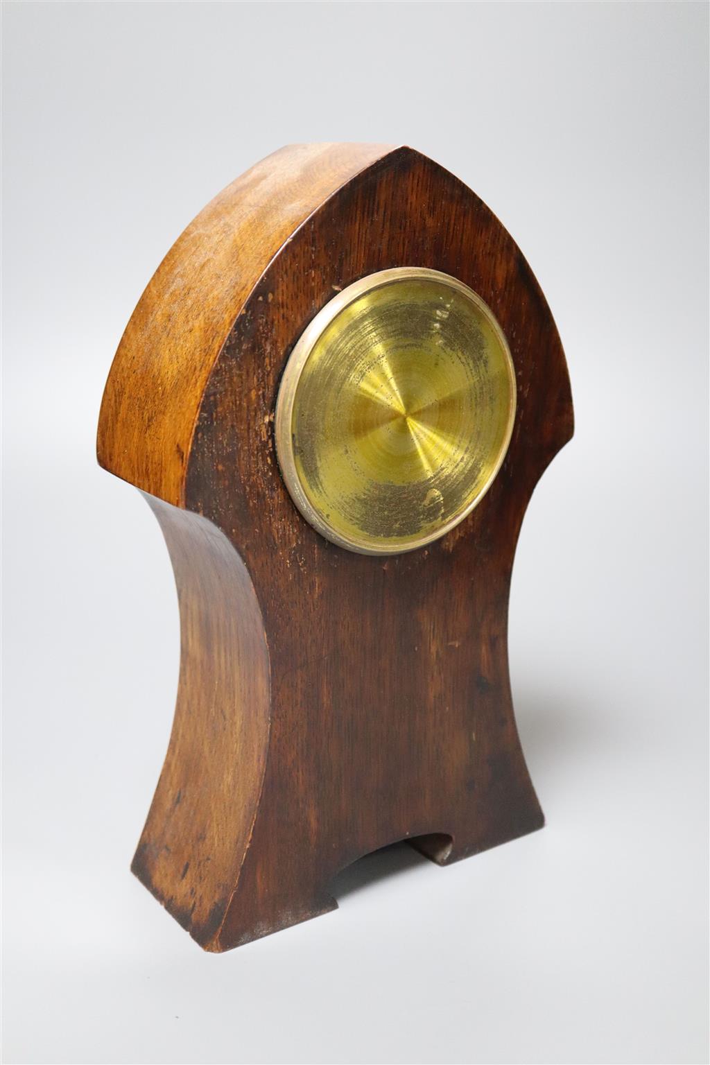 An Art Nouveau inlaid oak mantel clock, convex dial and French movement, case inlaid with copper strapwork, 28cm